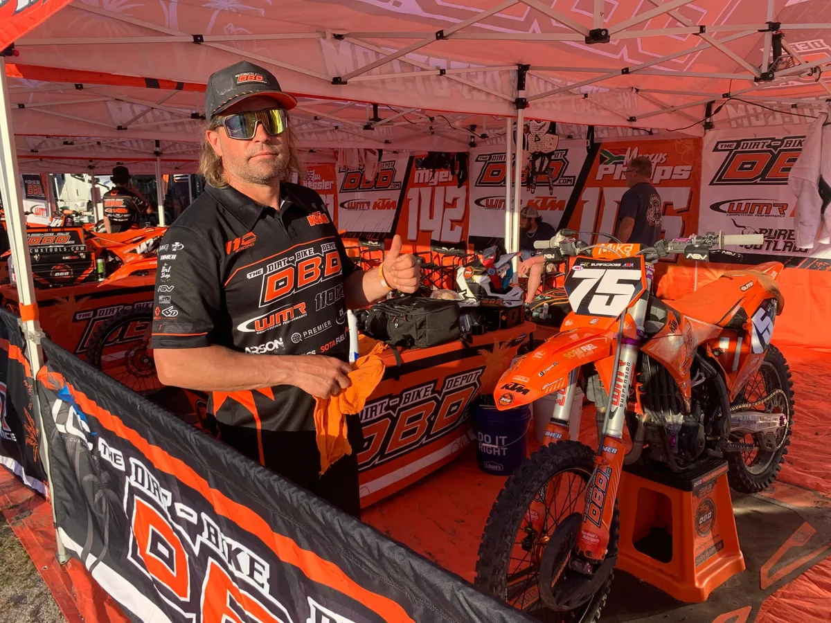 Race bikes on stands in the pits ready for setup work