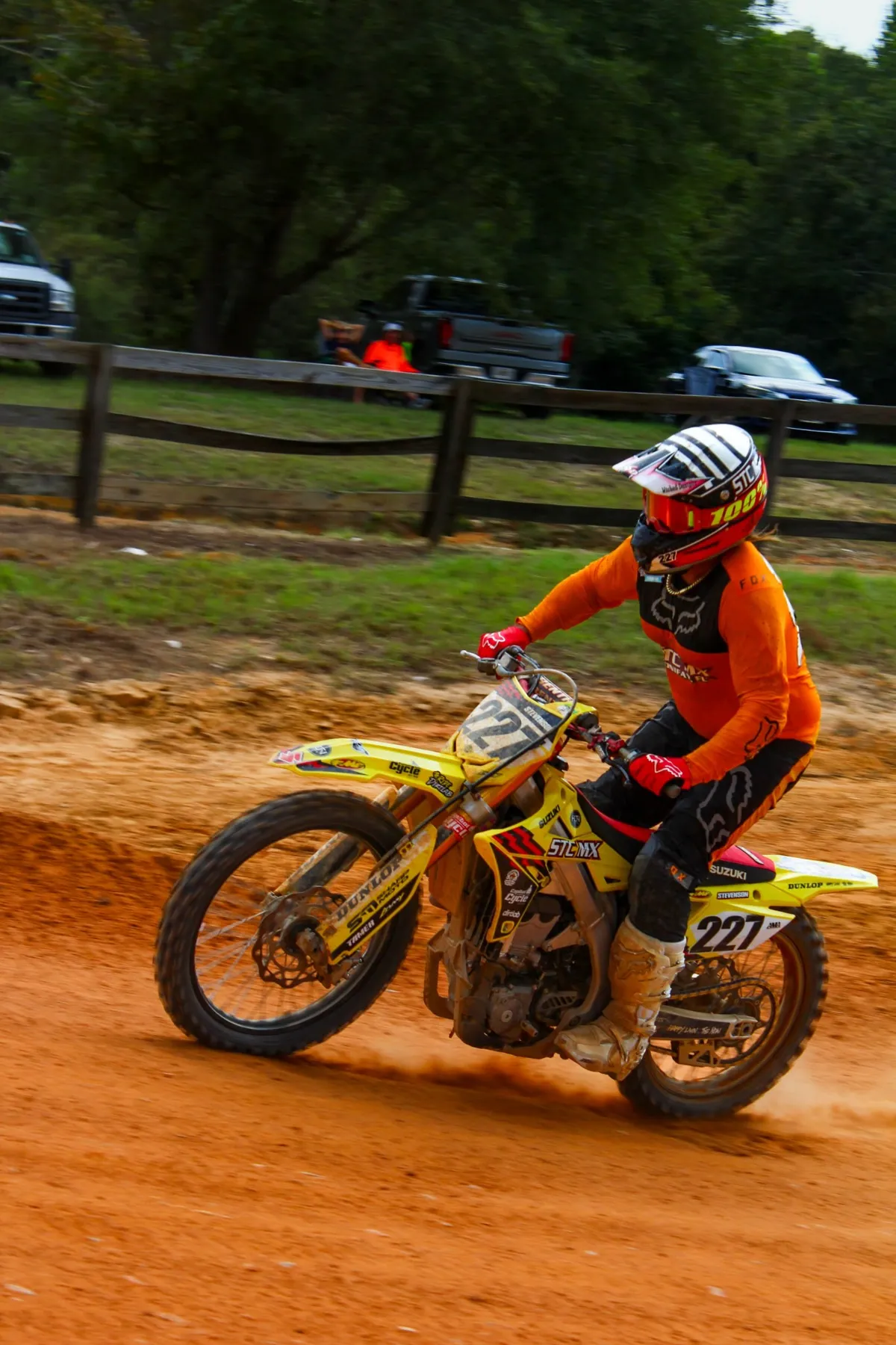 Rider number 227 carving a corner on the orange Florida dirt
